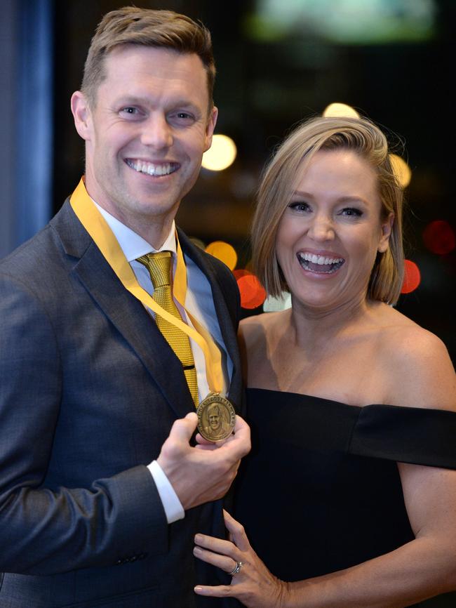 Sam Mitchell with his wife Lyndall after winning his fifth Peter Crimmins Medal. Picture: Eugene Hyland