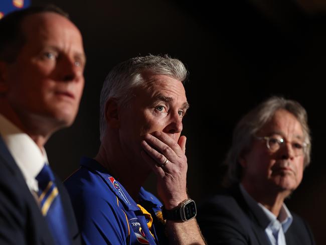 PERTH, AUSTRALIA - JULY 09: Adam Simpson looks on with Don Pyke (WCE CEO) and Paul Fitzpatrick (WCE Chair) after the West Coast Eagles and senior coach Adam Simpson mutually agreed that his 11-year tenure at the club will come to an end during a West Coast Eagles AFL press conference at Mineral Resources Park on July 09, 2024 in Perth, Australia. (Photo by Paul Kane/Getty Images)