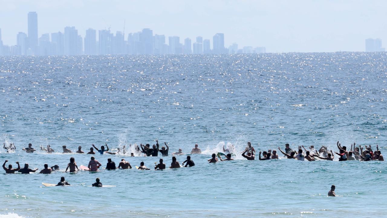 Hundreds of people turned out at the Greenmount Beach Surf Club on the Gold Coast to celebrate the life of Ed Fanning. His brother Mick led a surf out after the service. Picture: NCA NewsWire/Tertius Pickard