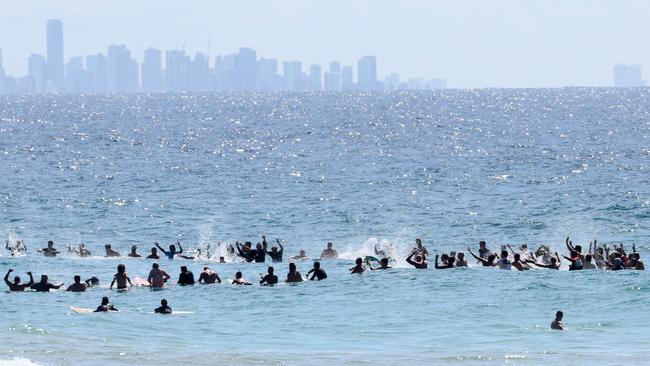 Hundreds of people turned out at the Greenmount Beach Surf Club on the Gold Coast to celebrate the life of Ed Fanning. His brother Mick led a surf out after the service. Picture: NCA NewsWire/Tertius Pickard