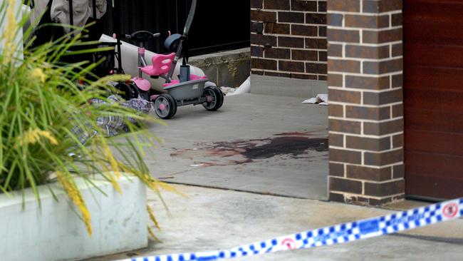 The bloodied crime scene at the doorstep of a neighbouring property where Mejid Hamzy stumbled after being shot and killed by masked gunmen in Condell Park. Picture: Jeremy Piper