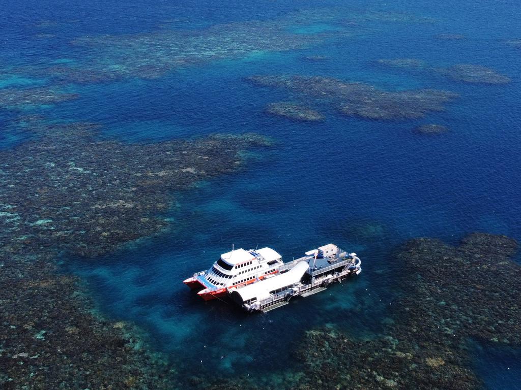 The Sunlover Reef Cruises pontoon and catamaran at Moore Reef, on the outer Great Barrier Reef. Picture: Brendan Radke