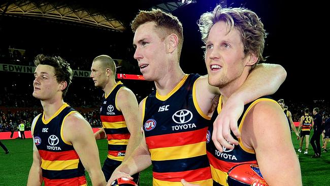 Matt Crouch, Tom Lynch and Rory Sloane celebrate the win. Picture: Mark Brake/Getty Images)