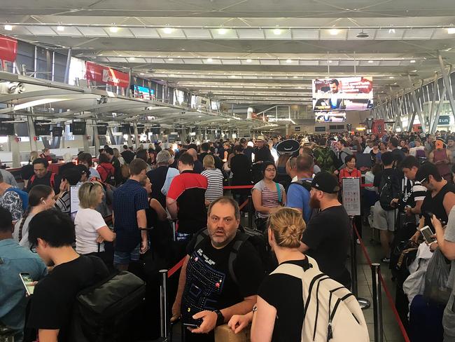 Chaos... Passengers at Domestic Terminal 2 this morning. Picture: AAP/Sallie Don