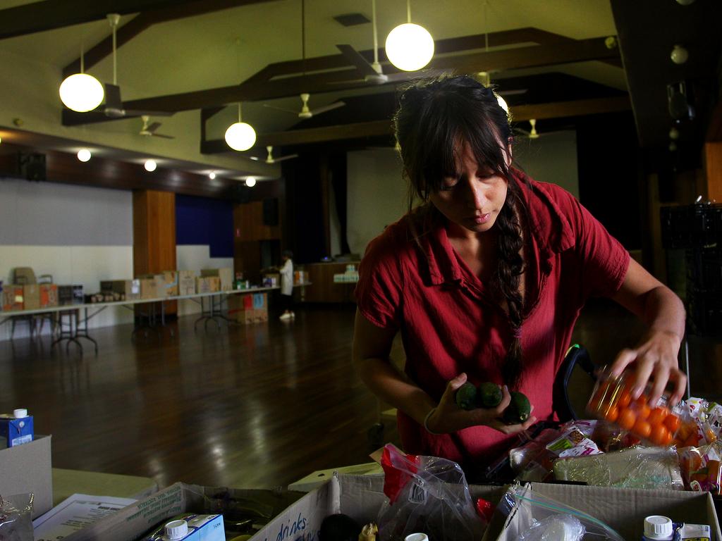 Clio Doughty, Family and Community Social Worker, prepares boxes of food essentials for those in need in Sydney, Australia. Picture: Lisa Maree Williams