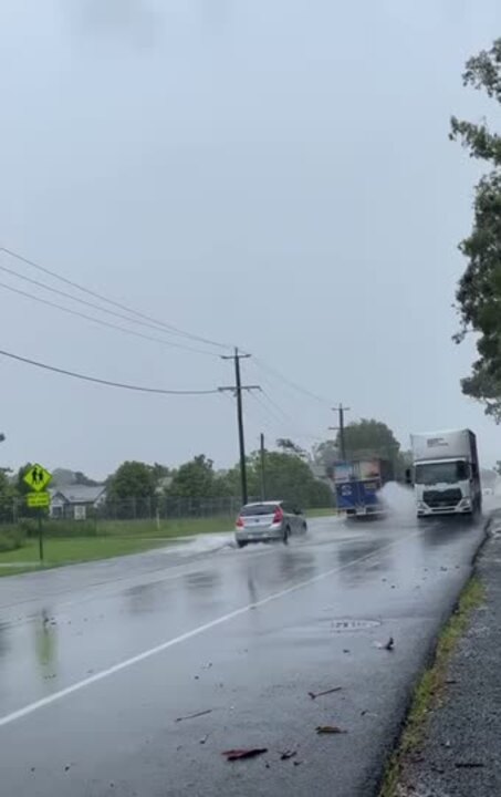 Cars driving through flood waters on the Gold Coast