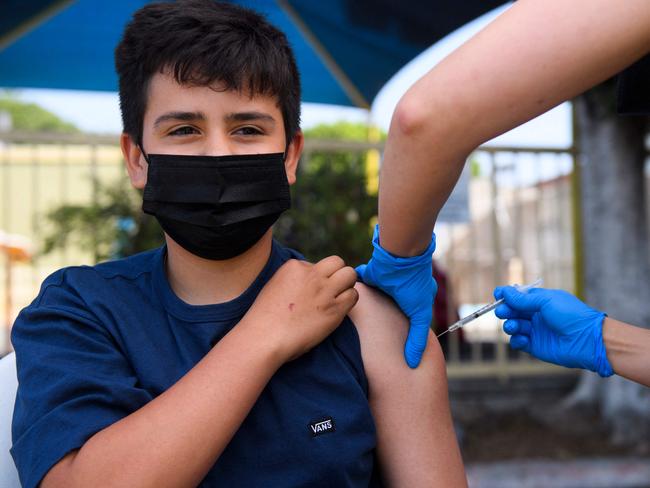 A teenager receives his vaccine in Los Angeles. Picture: AFP