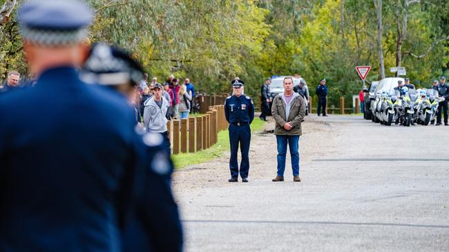 Todd Robinson, partner of Constable Glen Humphris, looks on at the repatriation ceremony. Picture: AAP Image/Simon Dallinger