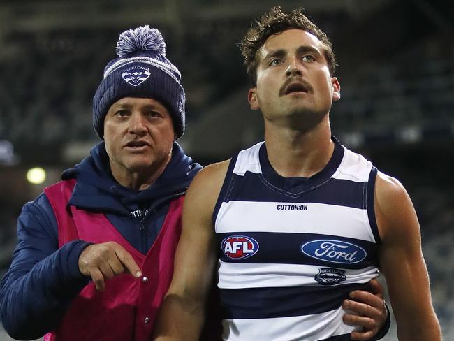 Luke Dahlhaus is taken from the ground by Dr Geoff Allen. Picture: Dylan Burns