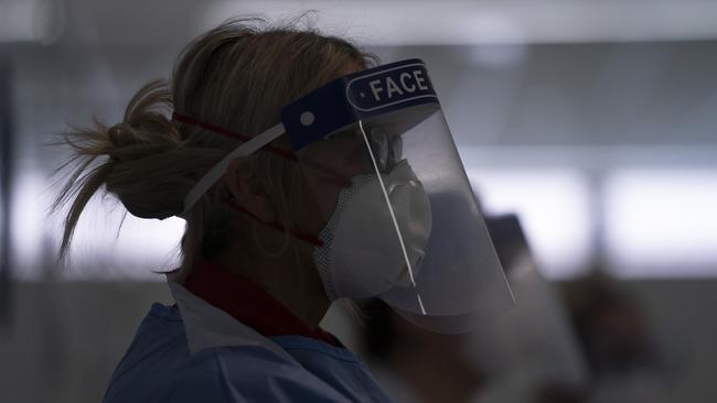 Medical staff receive training on how to put on and remove PPE to avoid being infected or transmitting coronavirus at the Nightingale Hospital North West set up in the Manchester Central Convention Complex in Manchester, northern England.