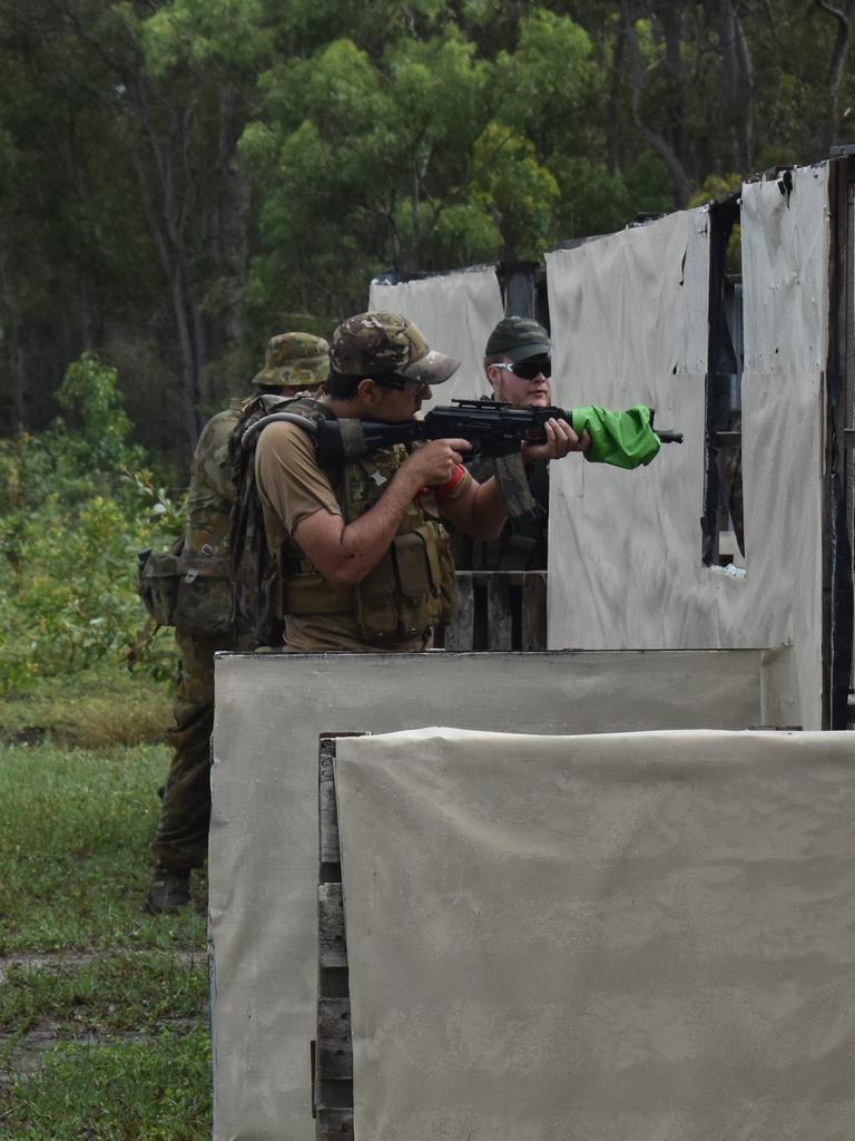 OPERATION TEMPEST: PLAM players clear a market venue from enemies during Operation Tempest on the Fraser Coast. Photo: Stuart Fast