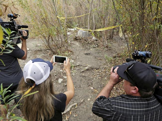 Journalists view the spot where Mark Salling was found dead in a remote area of Big Tujunga Canyon in Los Angeles. Picture: AP/Reed Saxon