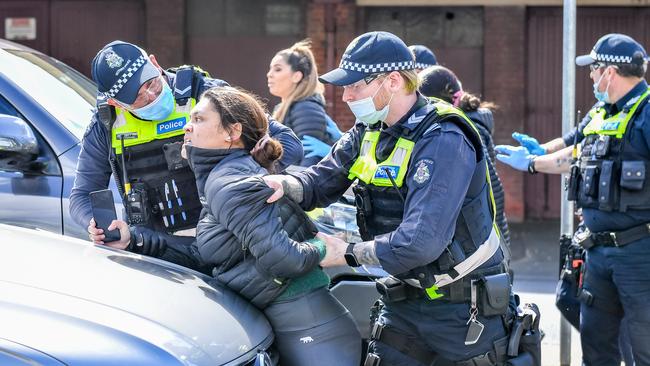 Protesters take to Queen Victoria Market to rally against lockdown restrictions earlier this month Picture: Jake Nowakowski