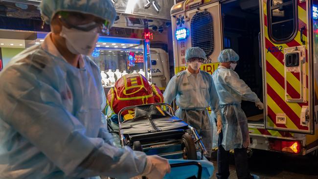 Paramedics at work in Hong Kong, where more people were confirmed to have contracted the coronavirus. Picture: Getty Images