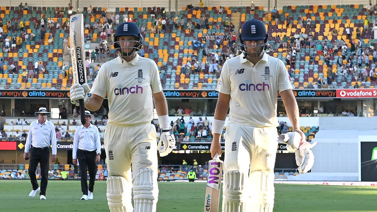 BRISBANE, AUSTRALIA - DECEMBER 10: Joe Root and Dawid Malan of England are seen leaving the field after day three of the First Test Match in the Ashes series between Australia and England at The Gabba on December 10, 2021 in Brisbane, Australia. (Photo by Bradley Kanaris/Getty Images)