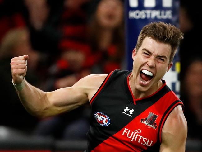 MELBOURNE, AUSTRALIA - MAY 07: Zach Merrett of the Bombers celebrates a goal during the 2022 AFL Round 08 match between the Essendon Bombers and the Hawthorn Hawks at Marvel Stadium on May 07, 2022 in Melbourne, Australia. (Photo by Dylan Burns/AFL Photos via Getty Images)