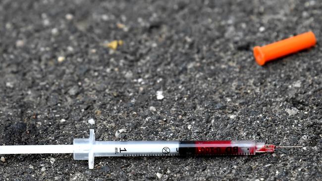 A blood-filled needle in a Richmond laneway the week after the injecting room opened. Picture: Nicole Garmston