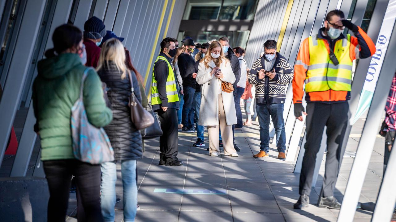 People queue to be vaccinated at the Melbourne Exhibition Centre on Tuesday. Picture: Jake Nowakowski