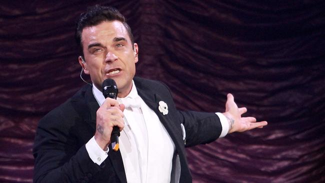 Robbie Williams plays to a sellout crowd at the Brisbane Entertainment Centre last night. Pic: Marc Robertson