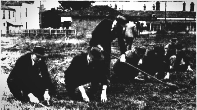 Police scouring the vacant lot where James Coates was found dead. Picture: Trove