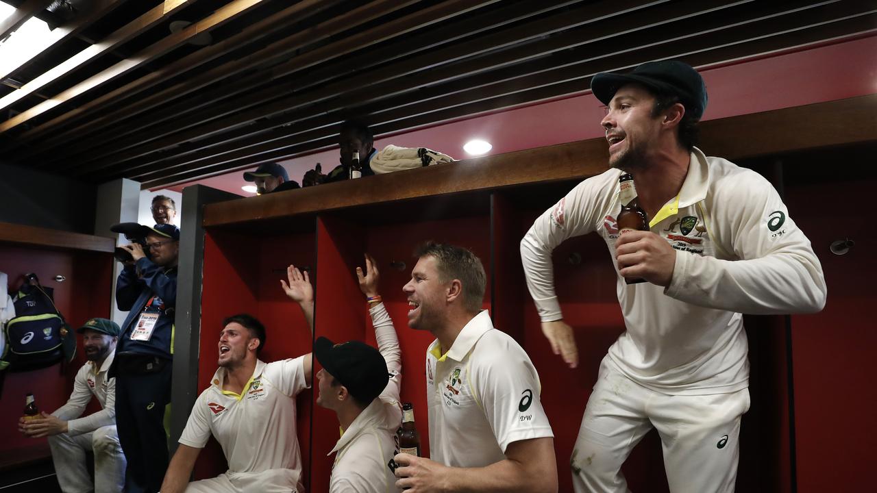 Australia’s cricketers have celebrated wildly after reclaiming the Ashes.