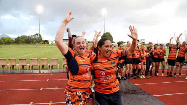 SNIP SNIP: Mudcrabs' Charlee Todd and Moera Blair celebrate their premier ship win. PICTURE: STEWART McLEAN