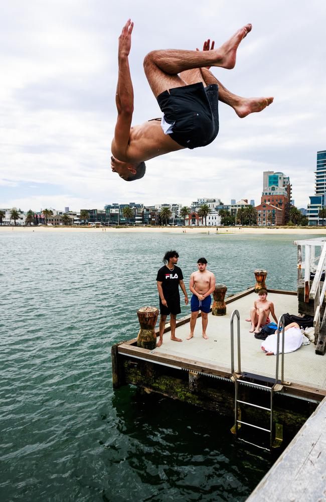 People cool down at Port Melbourne. Picture: Aaron Francis