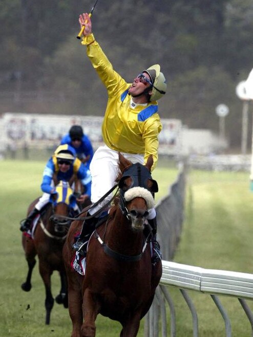 Damien Oliver turns to the sky as he wins the 2002 Melbourne Cup on Media Puzzle.