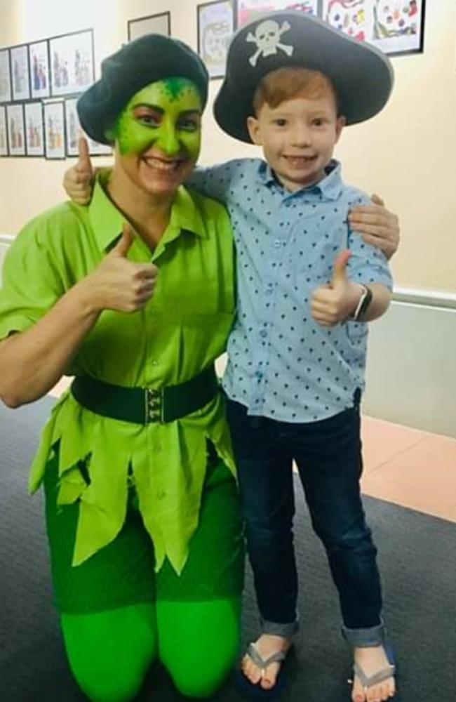 Jess Steele's son Oscar with one of the characters from the Towers Players Pantomime Sleeping Beauty and the Liquidator at the World Theatre.