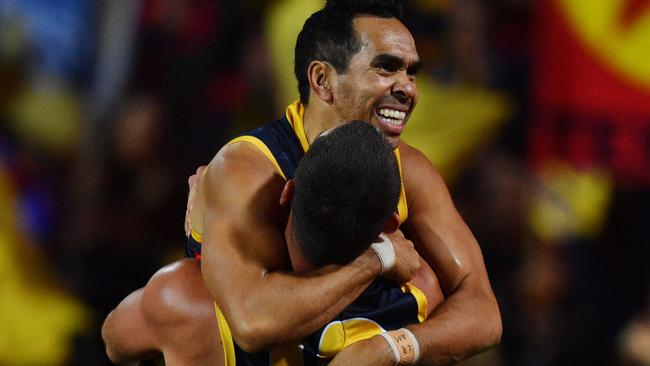 Eddie Betts celebrates a goal with Taylor Walker of the Crows during the Round 7 AFL match between the Adelaide Crows and the Fremantle Dockers at the Adelaide Oval in Adelaide, Sunday, May 5, 2019. (AAP Image/David Mariuz) NO ARCHIVING, EDITORIAL USE ONLY