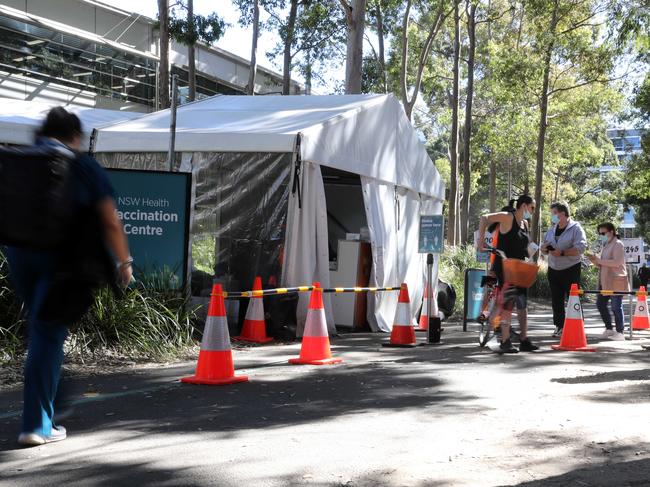 Sydney residents at the Sydney Olympic Park vaccination hub. Picture: NCA NewsWire / Christian Gilles