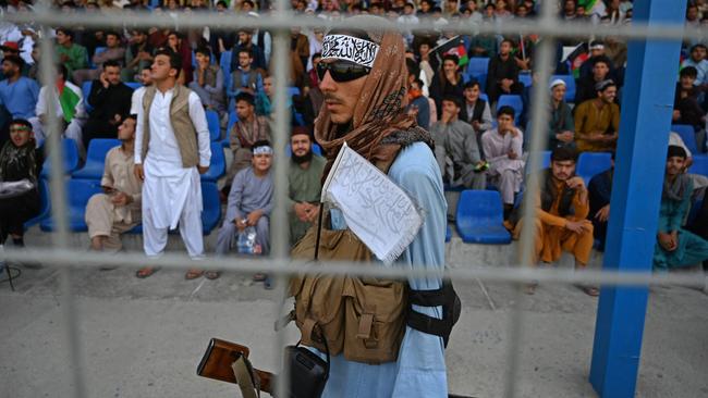 A Taliban fighter patrols a Twenty20 cricket match in Kabul last week. Picture: AFP