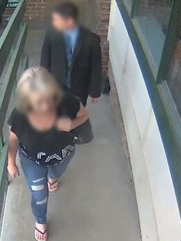 A woman is taken to Ryde police station to be charged. Picture: NSW Police