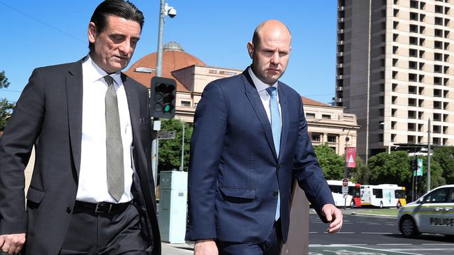 Politician Sam Duluk (right) arrives at the Adelaide Magistrates Court on Wednesday with lawyer Domenic Agresta. Picture: NCA Newswire/Dean Martin