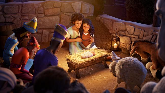 Joseph  and Mary  surrounded by animals in the manger.