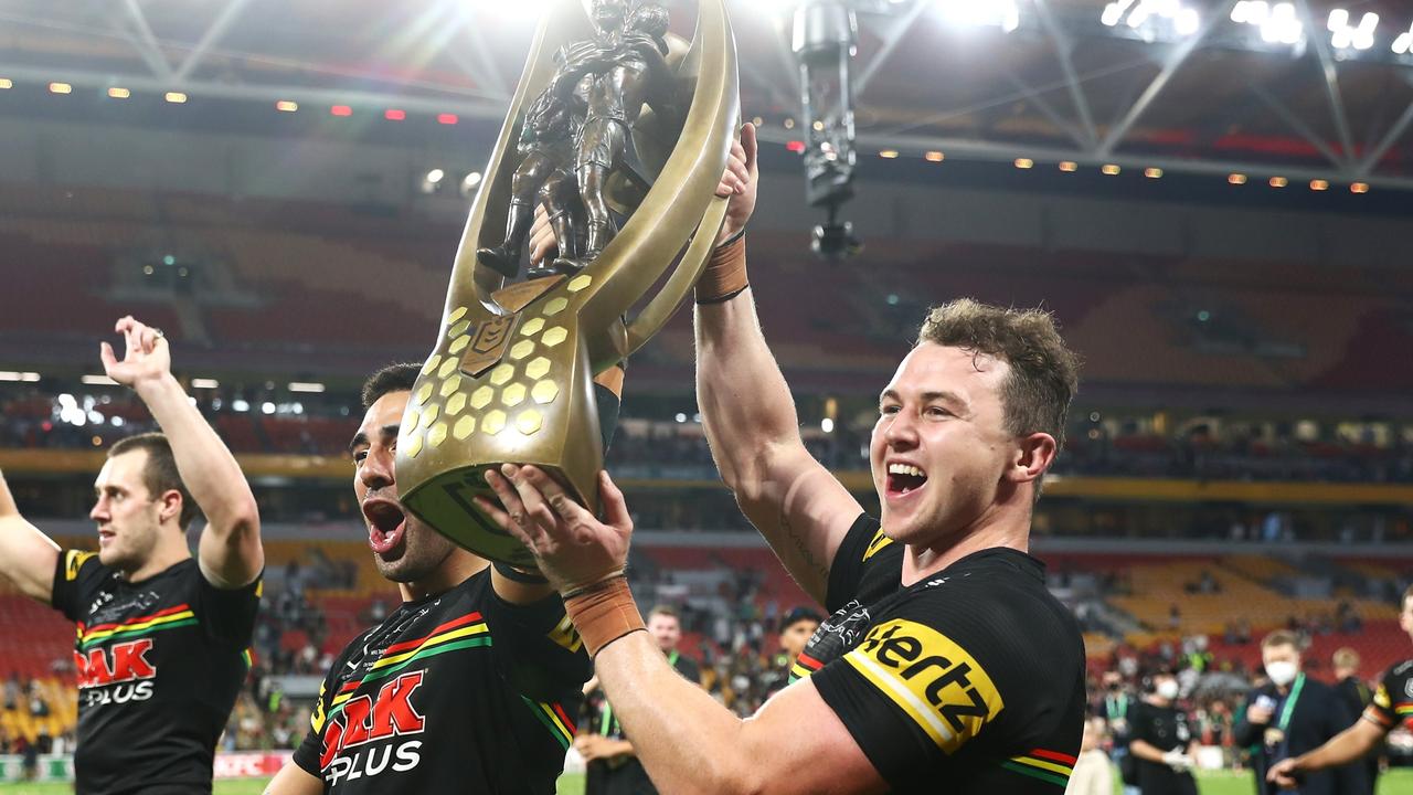 BRISBANE, AUSTRALIA - OCTOBER 03: Tyrone May and Dylan Edwards of the Panthers celebrate with the NRL Premiership Trophy after victory in the 2021 NRL Grand Final match between the Penrith Panthers and the South Sydney Rabbitohs at Suncorp Stadium on October 03, 2021, in Brisbane, Australia. (Photo by Chris Hyde/Getty Images)