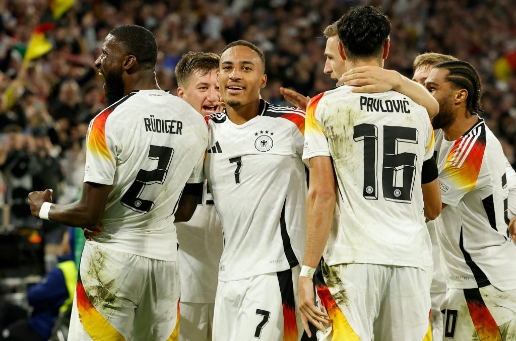 Germany's number seven Jamie Leweling celebrates with teammates after scoring against the Netherlands