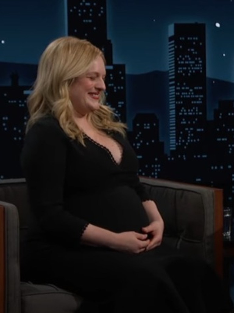 Moss shows off her baby bump.