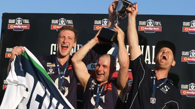 (From left) Nathan O'Keefe, Mark Cecere and coach Kane Shaw celebrate Seville’s premiership win. Picture: Stuart Milligan