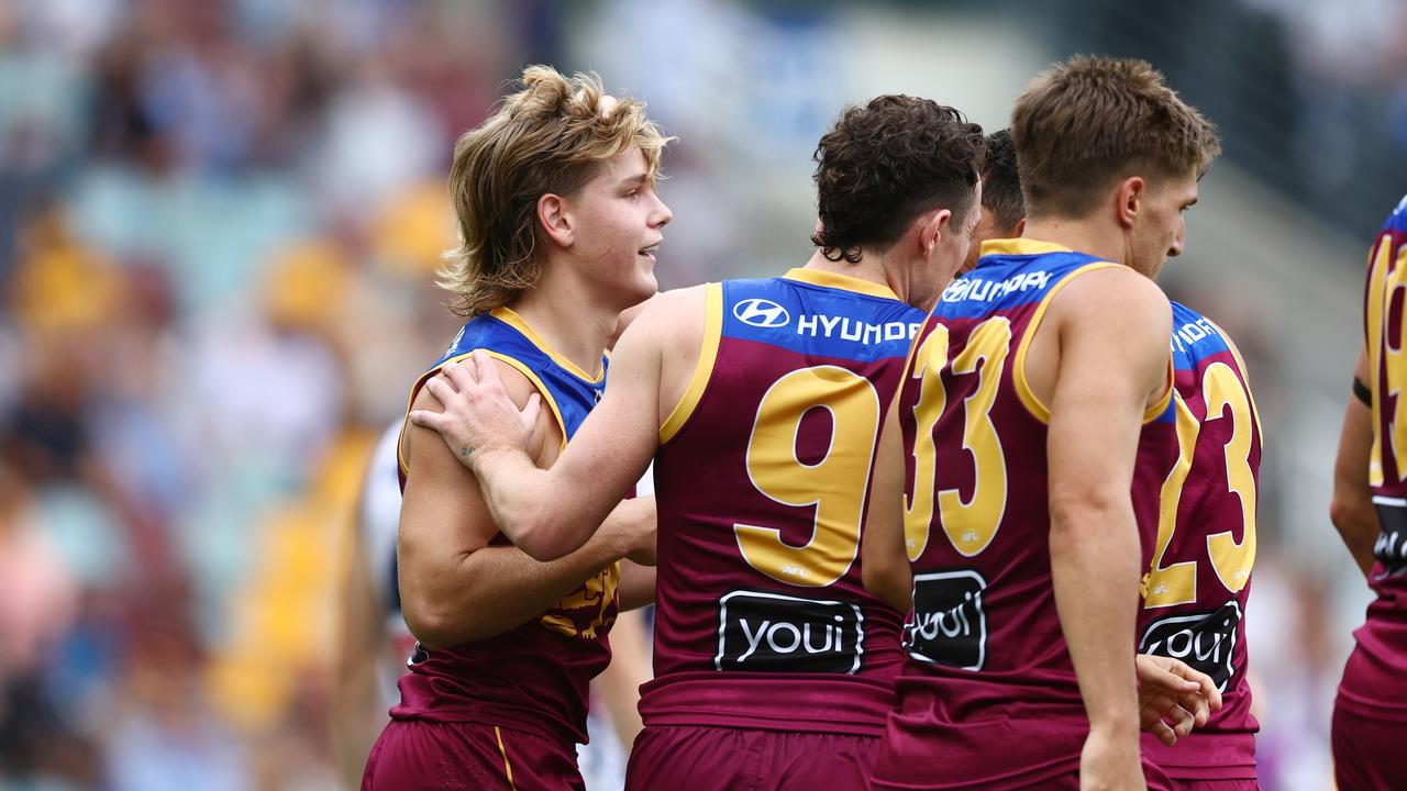 Will Ashcroft is congratulated by teammates after his goal.