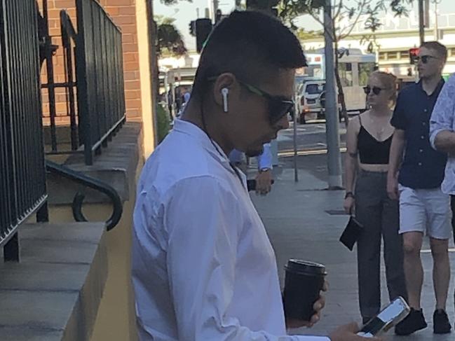 Daniel Thomas Neave, 26, of Narraweena, waits outside Manly Local Court on Wednesday, before he was sentenced to 12 months home detention for punching a police officer and high-range drink driving. Picture: Jim O'Rourke