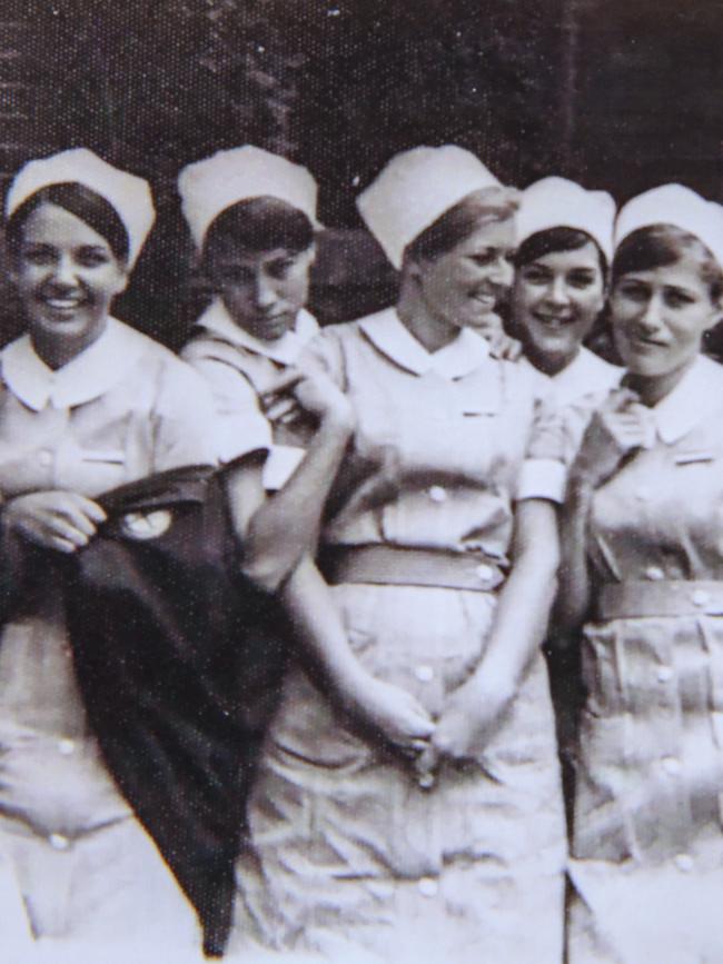 Lyn Dawson, centre, in her nursing uniform. Picture: Supplied