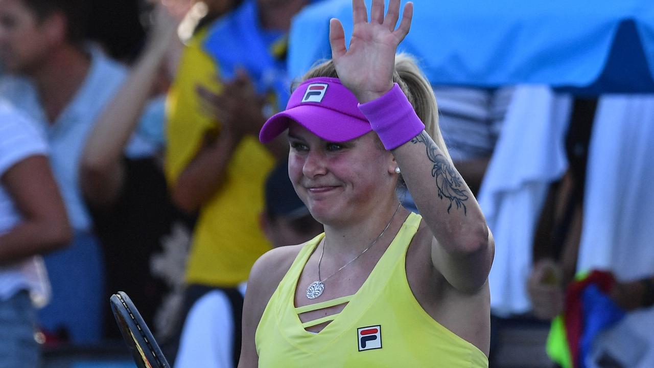 Ukraine's Kateryna Baindl celebrates after her victory against Russia's Kamilla Rakhimova on day one of the Australian Open. Picture: Paul Crock / AFP