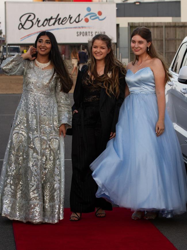 Maryam Fatima, Danielle Robert and guest at the 2023 St Lukes Anglican College formal.