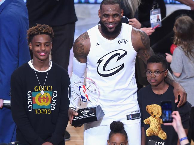 LOS ANGELES, CA - FEBRUARY 18: (L-R) LeBron James Jr., LeBron James #23, Zhuri James and Bryce Maximus James pose for a photo with the All-Star Game MVP trophy during the NBA All-Star Game 2018 at Staples Center on February 18, 2018 in Los Angeles, California. (Photo by Jayne Kamin-Oncea/Getty Images)