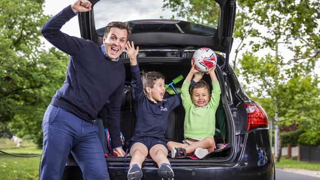 Jess White with his kids James, and Atticus getting ready to head on a road trip. Picture: Wayne Taylor