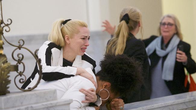 Bill Cosby accusers (left to right) Caroline Heldman, Lili Bernard and Victoria Valentino (far right) react after the guilty on all counts verdict was delivered.