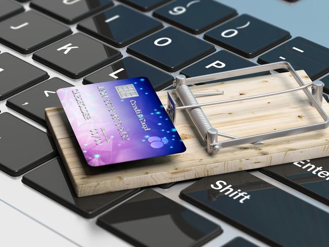 Credit card on a mouse trap, computer keyboard background, online shopping. 3d illustration, Online scams, fraud generic