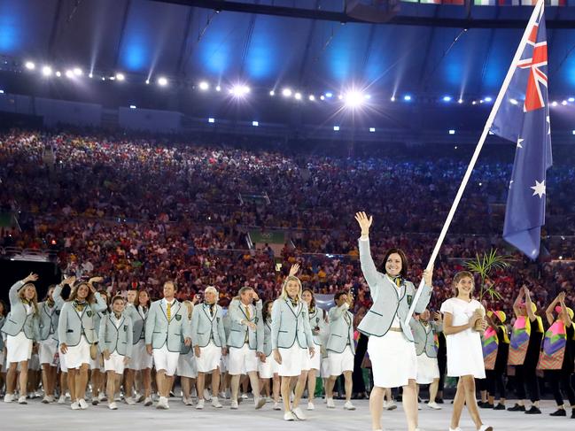 RIO DE JANEIRO, BRAZIL - AUGUST 05: Anna Meares of Australia carries the flag during the Opening Ceremony of the Rio 2016 Olympic Games at Maracana Stadium on August 5, 2016 in Rio de Janeiro, Brazil. (Photo by Cameron Spencer/Getty Images)