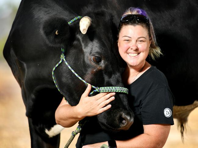 Trish Prendergast with her 3yo Dairy Steer 'Nemoo the Grass Puppy' who's helping people through the new wellness trend of 'cow hugging'. Picture: Alix Sweeney